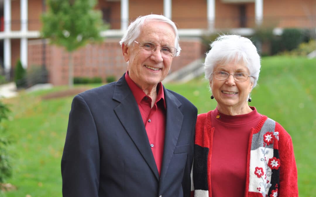 two people standing outside on the Milligan campus